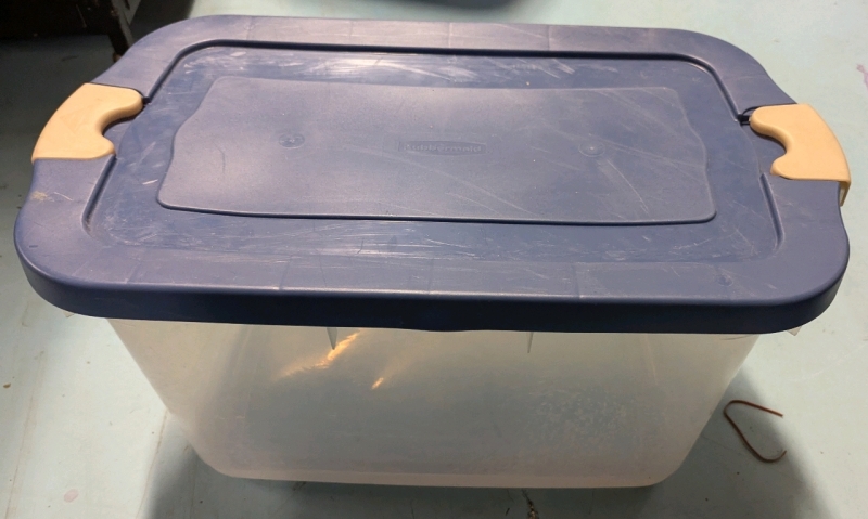 Plastic Rubbermaid Tote with Lid. Measures 14" by 15.5" by 26.5"