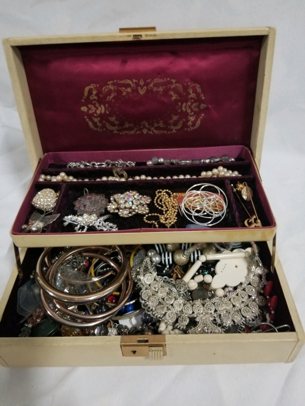 Vintage jewelry box with contents