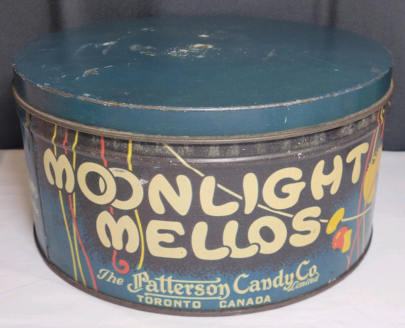 Vintage The Patterson Candy Co. Moonlight Mellos Tin with Lid . Measures 10.5" diameter & 5.5" tall