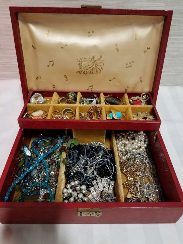 Vintage jewelry box with contents