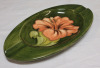 Vintage Moorcroft Pottery Hibiscus Oval Ashtray w/Original Sticker on Bottom , measures 6 1/4"&times;3.5" . Minor crazing present on bottom