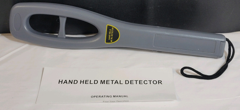 Hand Held Metal Detector , measures 14 3/4" long . Tested Working