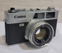 Canon QI-17 35mm Film Camera with Canon SE 45mm Lens . Untested . Lens end has two (2) dents