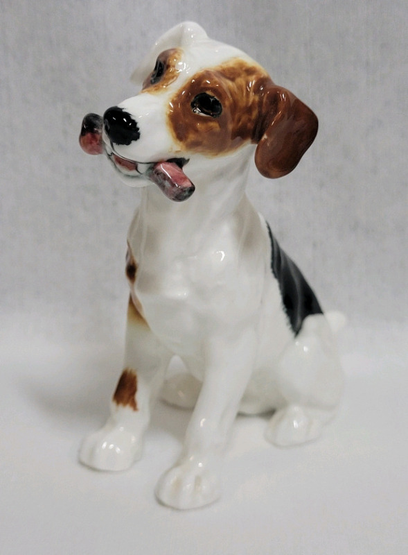 Royal Doulton Terrier Dog with Bone Character Dog . Measures 3 3/4" tall . No chips or cracks