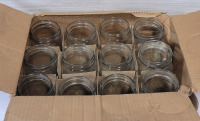Twelve (12) 500ml Mason Jars , No Lids . Would benefit from cleaning before use
