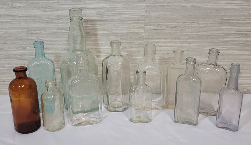 Vintage Assorted Medicine & Spirts Bottles , 12 Bottles . Measure 4.5" to 10" tall .