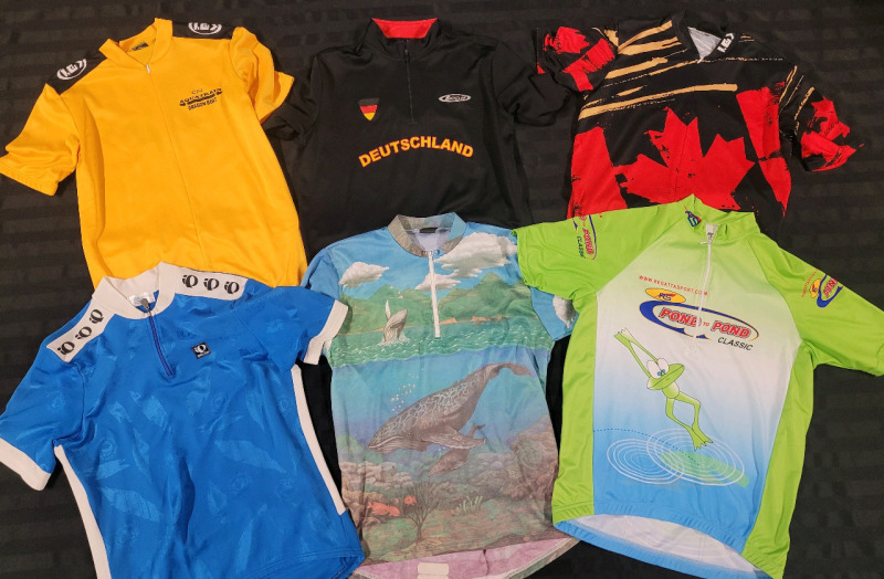 Men's Short Sleeve Cycling Jersey's . Some with Team Names & Sponsors . Men's Sizes Medium & Large