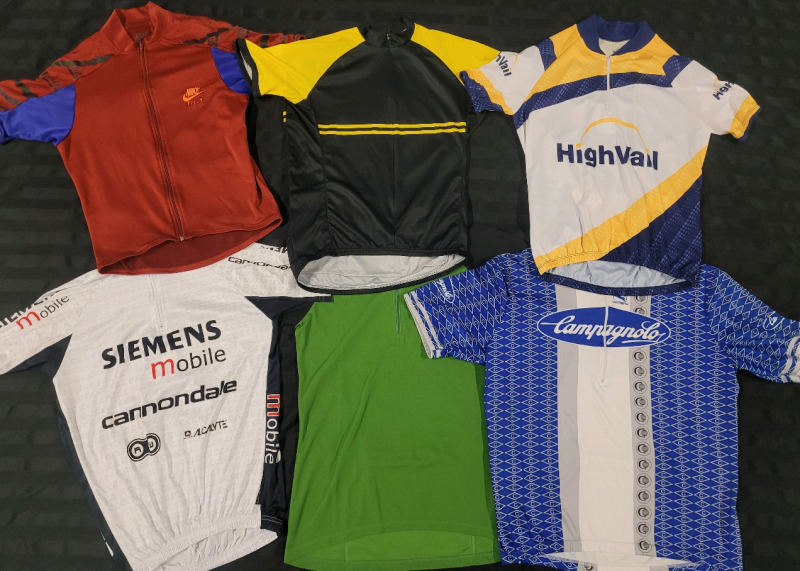 Men's Short Sleeve Cycling Jersey's . Some with Team Names & Sponsors . Sizes Small , Medium & Large