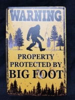 New Tin WARNING PROTECTED BY BIG FOOT sign 12" by 8"