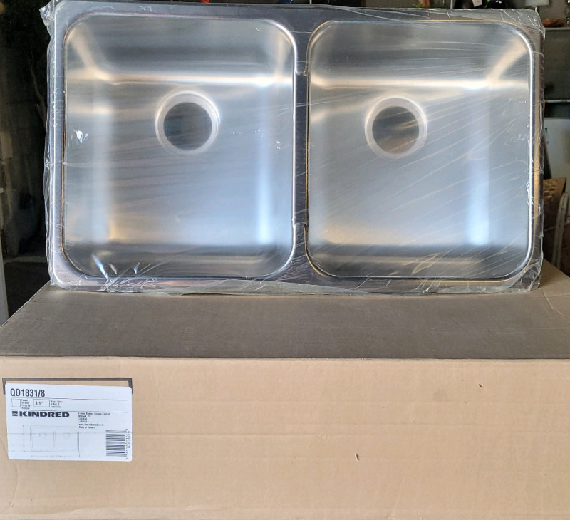 New - Kindred 31 1/4" Drop In Double Bowl Stainless Steel Kitchen Sink . Measures 31 1/4"&times;18 1/8"&times;7.5"