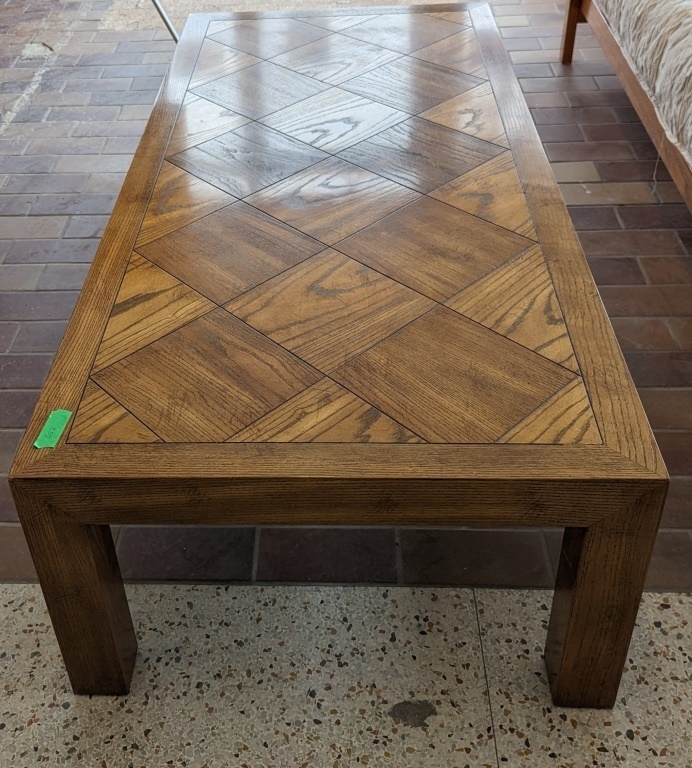Solid Wood Lane Brand Coffee Table. 56.25" long x 26" wide x 15" tall. Appears to be Oak.