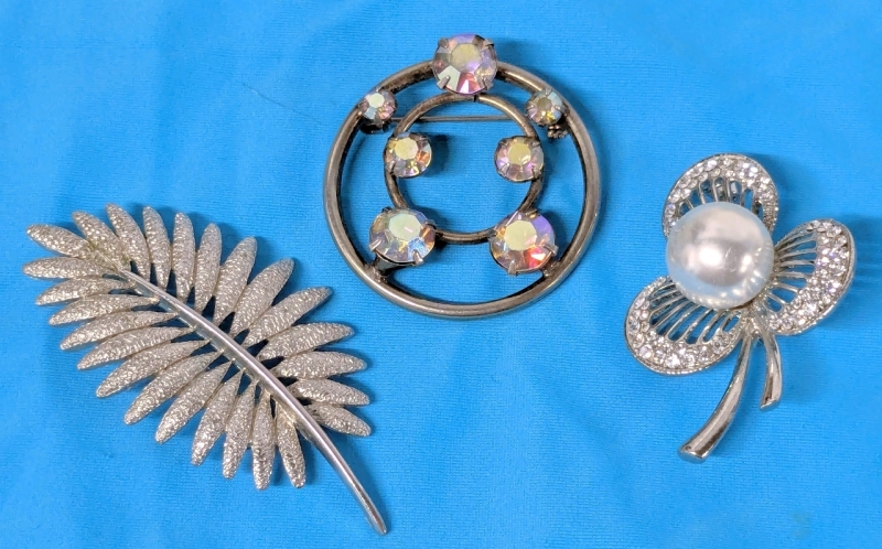 3 Vintage Silver Tone Brooches | Palm Frond Stamped 0765, Circular w AB Rhinestones, 3-Leaf Clover w Faux Pearl | Largest 2.5" Long