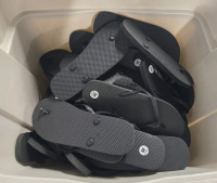 25+ Pairs | Lot Of Assorted Plain Black Flip Flops | Size Ranging From Small ( 5-6 ) - Extra Large ( 9-10 ) | Bin Of Flip Flops Measures 23.5" X 18" x 18" ( Bin Is Rougly ¾ Full