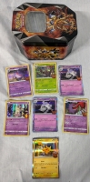 200+ Pokemon Trading Cards With Tin. Commons to Rares. Holographic included.