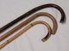 Three (3) Wooden Walking Canes . Measures 36" to 37" Tall - 2