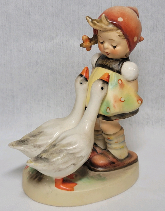 Goebel Hummel " Goose Girl " Figurine . Measures 4 1/4" tall . Minor crazing present