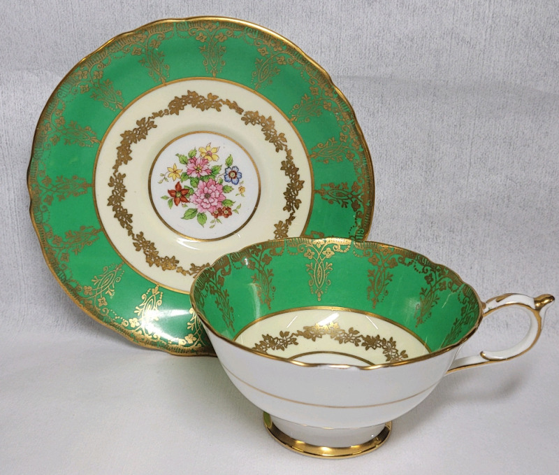 Paragon Double Warrant Green / Gold Trim w/Flower Center Cup & Saucer . Both Ring True . No chips or cracks