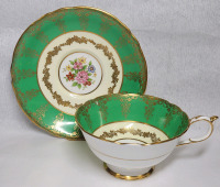 Paragon Double Warrant Green / Gold Trim w/Flower Center Cup & Saucer . Both Ring True . No chips or cracks