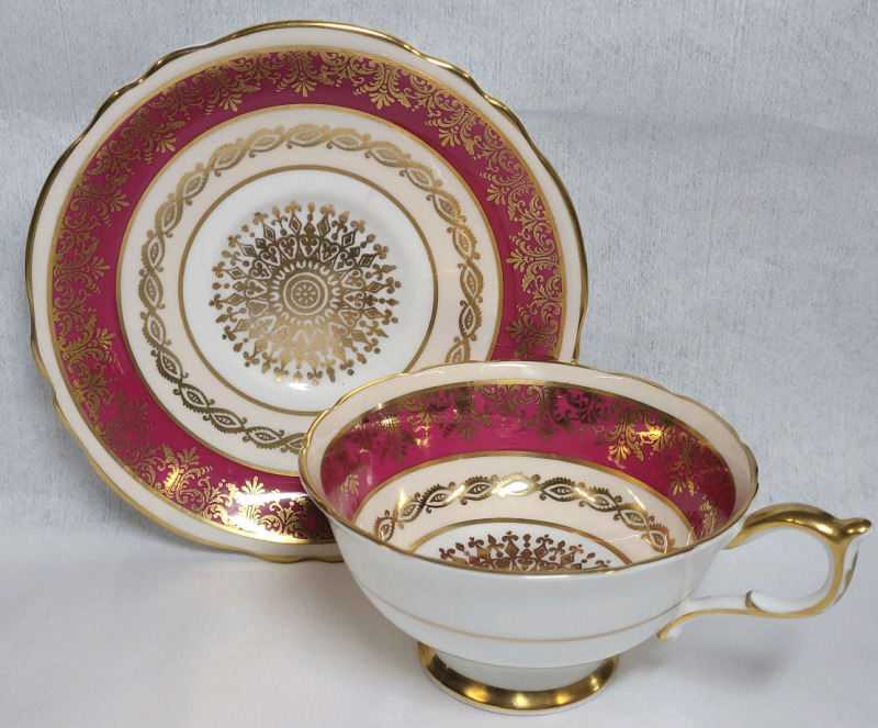 Paragon Double Warrant Red Border w/Gold Design Cup & Saucer . Saucer Rings True , Cup Does Not (small crack near handle & side) .