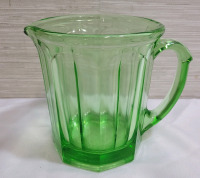 Vintage 1930s A & J Uranium Glass Pitcher . Measures 5.5" tall . Minor flea bites on seam .