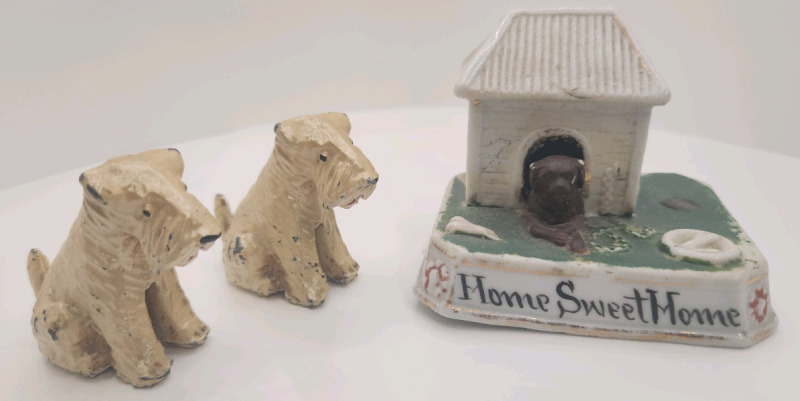 2 cast metal Terrier figurines and porcelain dog house figurine.