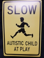 New tin sign AUTISTIC CHILD 12" by 8"