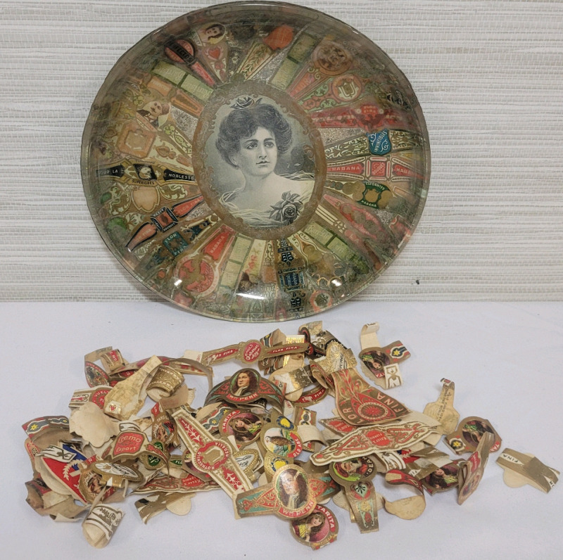 Folk Art Cigar Band Glass Ashtry with Vintage Loose Cigar Bands . Ashtray measures 7 1/4" diameter