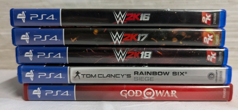 5 PlayStation 4 Games. WWE 2K16, WWE 2k17, WWE 2K18, Tom Clancy's Rainbow Six Siege, God of War.