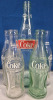 Assorted Glassware: 5 Glass Coke Bottles (Green + Clear), 2 Hires Root Beer Glasses, 4 Mason Jars (Green + Clear) | Tallest Glass Measures 11" Tall - 2