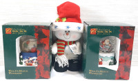 Two Holiday Collections Wind Up Waterglobes With 11½" Tall Snowman Decoration, Packages Have Dents and Scuffs, One Globe Does Not Have Water in It