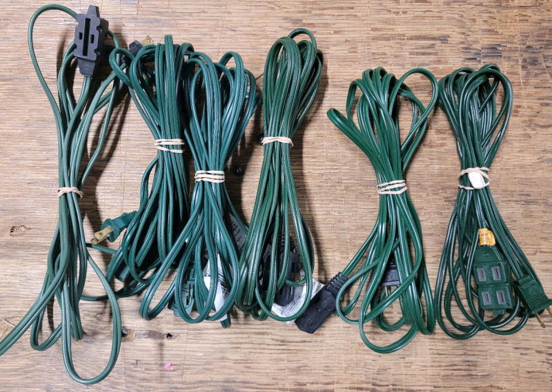 Six (6) Indoor / Outdoor 2-Prong Extension Cords . Five (5) 15ft. Cords & One (1) 10ft Cord