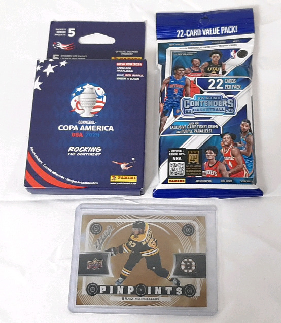 Lot of New Multi-Sport Trading Cards, Including Panini Conmebol Copa America USA 2024 Album Sticker Packets (5 Stickers per Pack), 2023-2024 Panini Contenders College Basketball 22-Card Pack & 2022-23 Upper Deck NHL Brad Marchand Boston Card