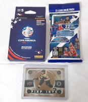 Lot of New Multi-Sport Trading Cards, Including Panini Conmebol Copa America USA 2024 Album Sticker Packets (5 Stickers per Pack), 2023-2024 Panini Contenders College Basketball 22-Card Pack & 2022-23 Upper Deck NHL Brad Marchand Boston Card