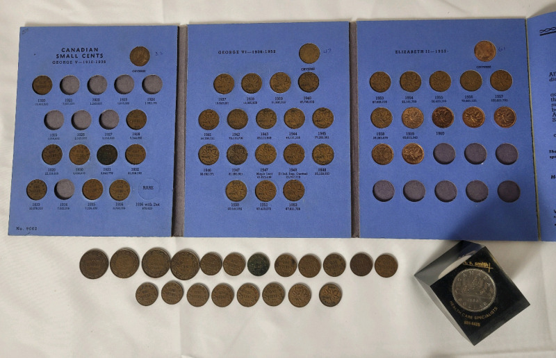 1909 - 1916 Canada Large Cent Pennies , 1920 - 1964 Canadian Pennies in Blue Book w/Extras & 1986 Canadian One Dollar Coin in Resin Cube .