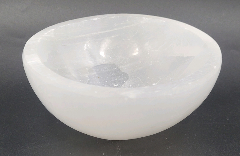 Selemite Mineral Bowl , measures 1 3/4" tall & 4" diameter . Selemite (gypsum) is believed to carry potent energy that can provide protection and improve well-being .