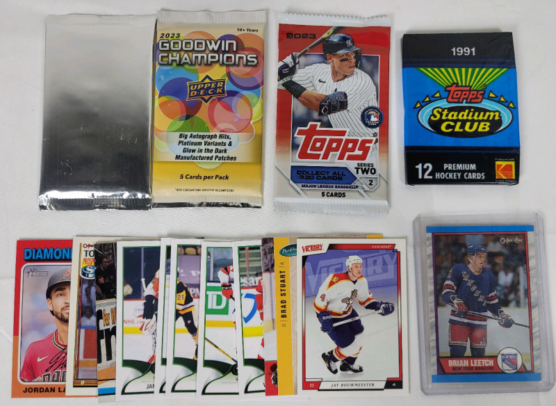 Sports Trading Card Lot : 2023 UD Goodwin Champions Packs , 2023 Topps Baseball Pack , 1991 Topps SC Hockey Pack , Brian Leetch 2nd Year Card & Hockey Singles Cards