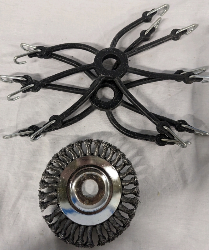 2 Spider Bungee Cords and a Derusting Weeding Wheel. Wheeling Wheel is 6" Across.