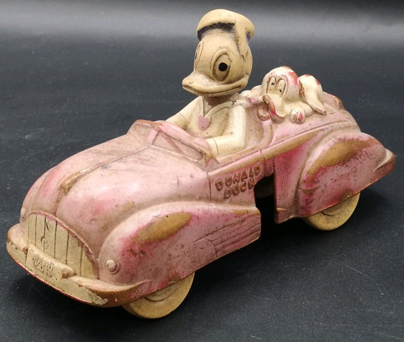 Vintage 1959's Rubber Disney Donald Duck and Pluto Car. Marked Viceroy SUNROCO Made in Canada . Piece missing on side