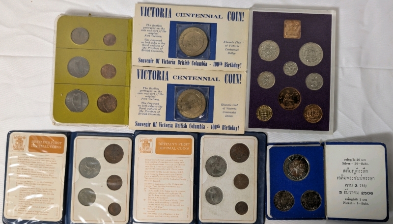 1962-71 Coin Lot Containing 2 1962 Victoria Centennial Coins, 1963 Thai Commemorative Coin Including Silver 20 Baht Coin 1970 UK & N. Ireland Coin Set (Uncirculated), 2 1971 Britain's First Decimal Coins Set & 1971 Ireland's Decimal Coin Set