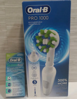 New Oral-B Pro 1000 Rechargeable Toothbrush & Oral-B SuperFloss