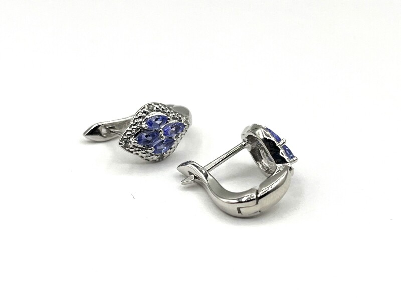 Sterling Silver Natural Tanzanite (0.65ct) With Natural White Topaz (0.10ct) Earrings, W/A $530.00. Tanzanite is the birthstone for December.