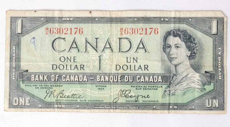 1954 Canadian Bank of Canada " Devils Face " One Dollar Bank Note . Has been in circulation