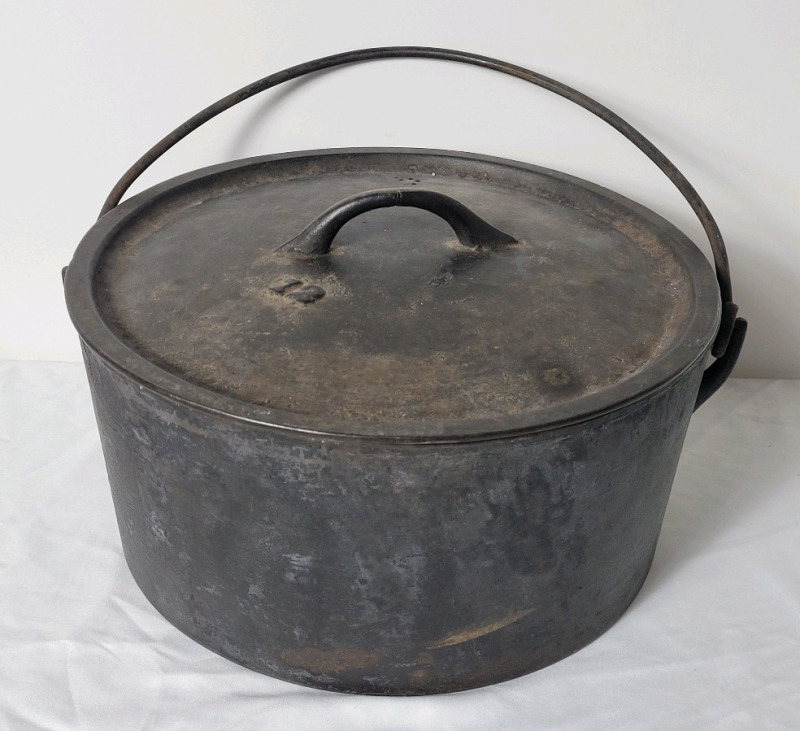 Vintage #12 Cast Iron Dutch Oven Pot with Lid . Measures 12" diameter & 5 3/4" tall . Would benefit from cleaning & seasoning before use