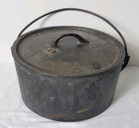 Vintage #12 Cast Iron Dutch Oven Pot with Lid . Measures 12" diameter & 5 3/4" tall . Would benefit from cleaning & seasoning before use