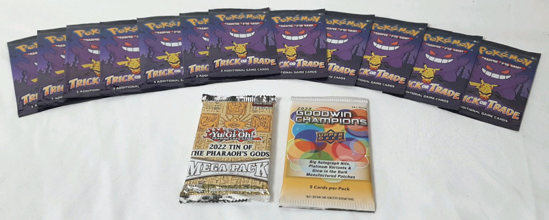 12 Packs of Pokemon TCG Trick or Trade Card Packs (Includes 3 in each pack) & Yu-Gi-Oh 2022 Tin of The Pharaoh Gods Mega Card Pack (Includes 18 Cards) & Upper Deck 2023 Goodwin Champions Sports Trading Card Pack (Includes 5 Cards)