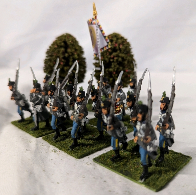 4 Quartets (16 figures) of Hand painted Lead Figures. Painted as the 3rd Brigade Hoch Und Deutschmeister on Flocked Bases. 1.5" Tall. With trees