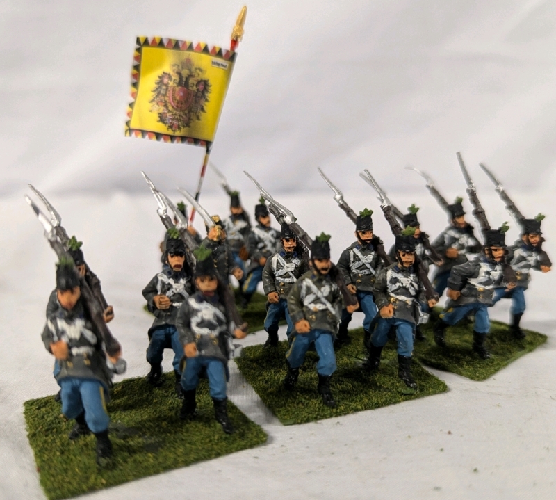 4 Quartets (16 figures) of Hand painted Lead Figures. Painted as the 3rd Brigade under the King of Belgions on Flocked Bases. 1.5" Tall.