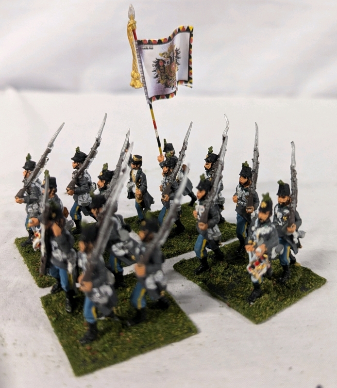 4 Quartets (16 figures) of Hand painted Lead Figures. Painted as the 1st Brigade Under Graf Hartman on Flocked Bases. 1.5" Tall.