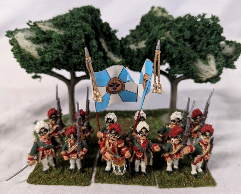 3 Quartets ( 12 Total) of Hand-painted Lead Miniatures. Labelled as Leib Guard Grenadiers of the Preobrazkenski Regiment.1.25" Tall. With Trees