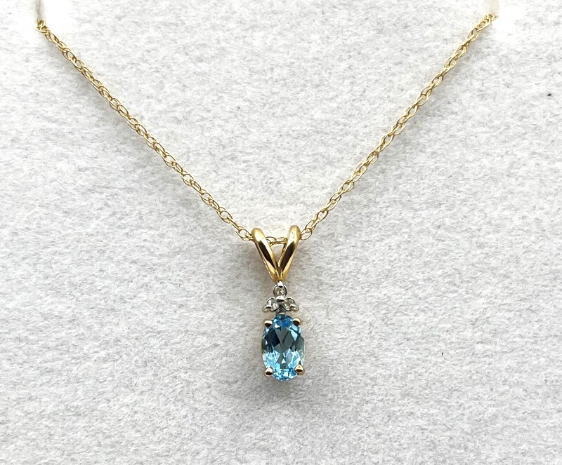 10KT Yellow Gold Natural Blue Topaz (0.50ct) and Natural Diamond (0.02ct) Pendant With 10KT Yellow Gold Chain, W/A $670.00.